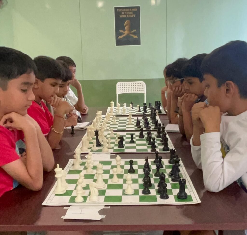 Children playing chess at Jignasa World Nallagandla