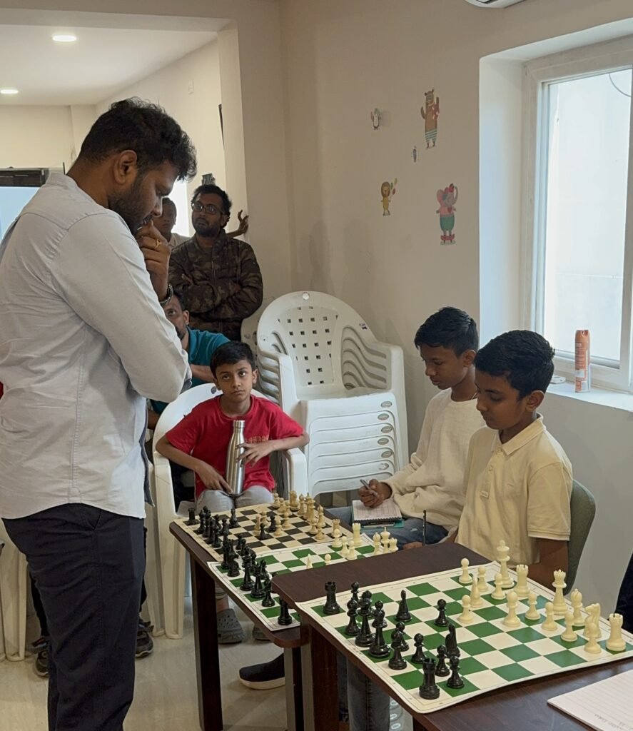 students simultaneously playing with the grandmaster opponent